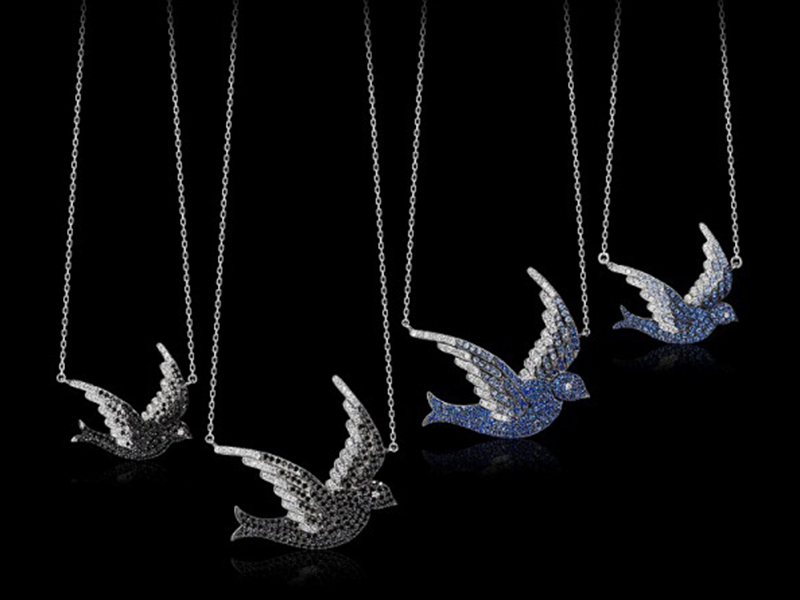 1- AS29 From the Pave Bird Collection, the pendants are mounted on white gold and set with white diamonds and blue sapphires. ~ 2'500 Euros.