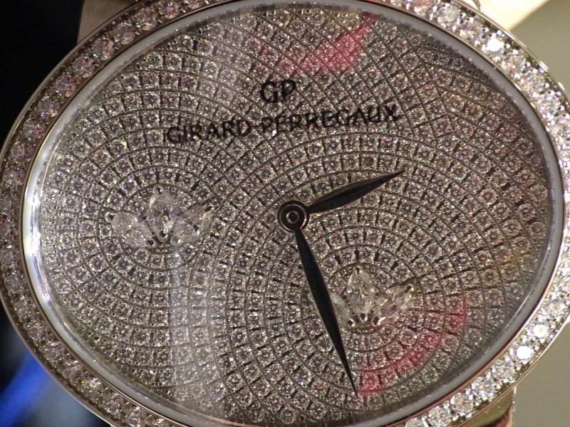 5- Girard-Perregaux set trios of marquise diamonds within the full-diamond paved dial of the new cat’s eye.