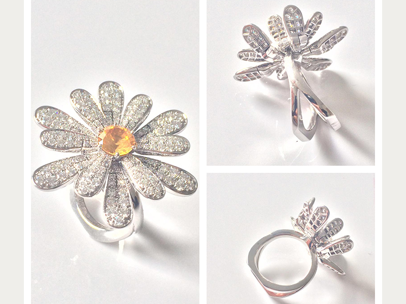 A yellow sapphire of 1.30 carats with petals set with 162 diamonds (1.89 carats) and mounted on white gold ( ~ 28'000 Euros)