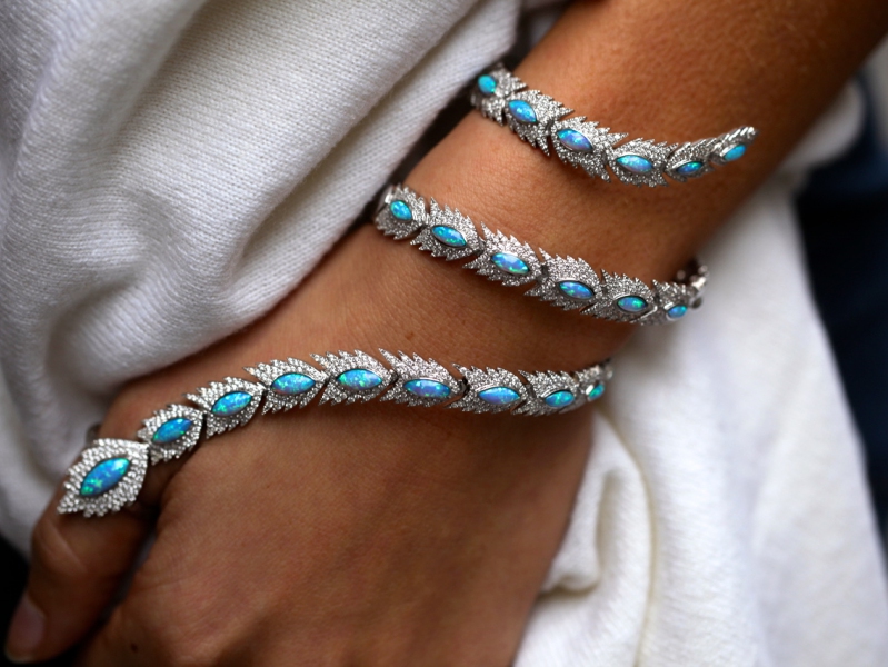 © India Weber Wearing Aaron Jah Stone phoenix Bracelet set with diamonds and black opals