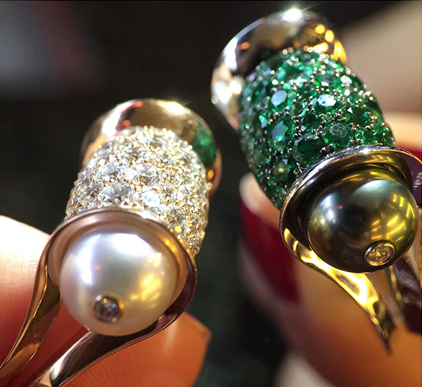 John Rubel Ginger Rings. On the left - white diamonds with white pearls On the right emeralds with black pearls.