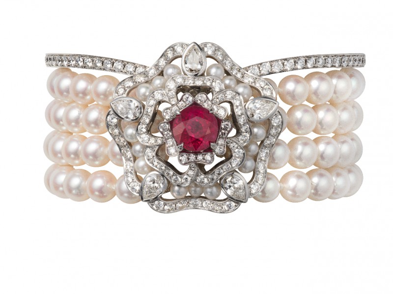 Garrard Bracelet mounted on white gold with white pearls and a ruby surrounded by white diamonds