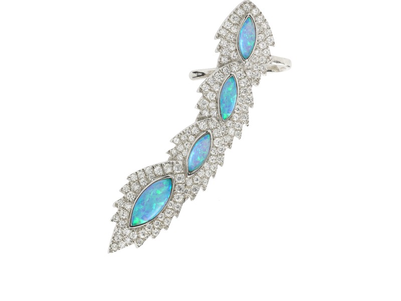 Aaron Jah Stone This ear cuff from Phoenix collection with 4 opal and diamonds is available at the Pop Up - CHF 1'250