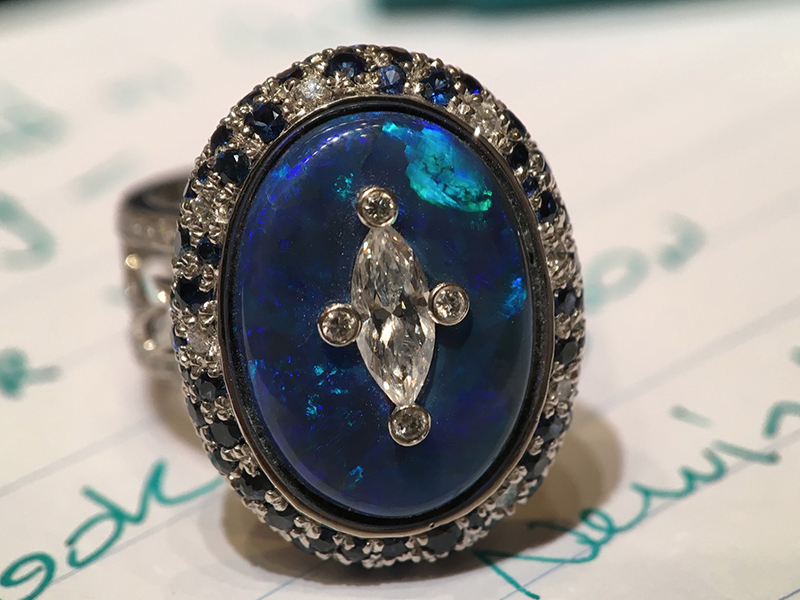 Katherine Jetter Astro Ring - Black opal surrounded by blue sapphires and diamonds