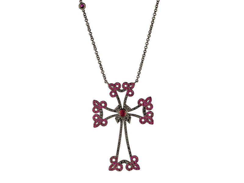 Laura Sayan Arev cross diamants mounted on black gold with rubies and black diamonds. Available at the Pop Up, CHF 4'110