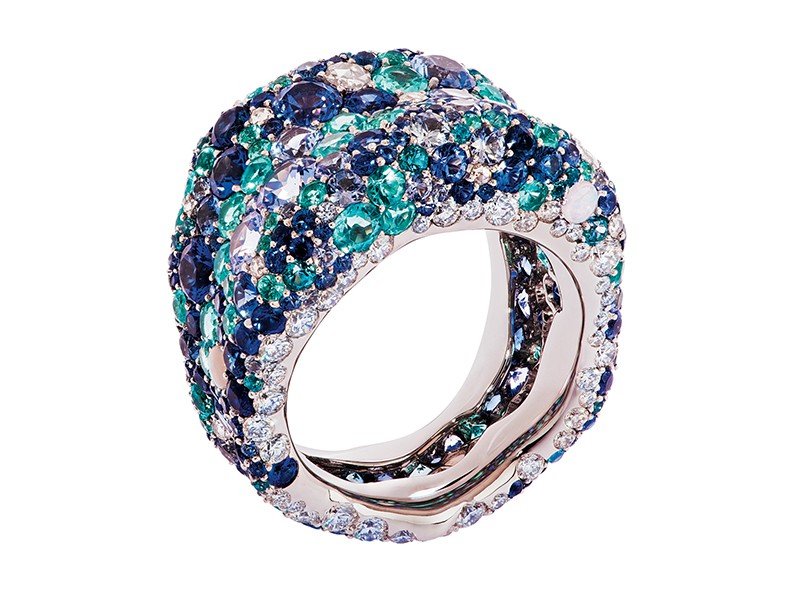 Fabergé Emotion Blue Ring set on White Gold with 86 Round White Diamonds (1.46cts), 13 Rosecut White Diamonds (0.24cts), 242 Round Blue Sapphires (9.91cts), 5 Round Opals (0.16cts), 69 Round Paribas (1.03cts), 19 Round Blue Topaz (0.31cts).