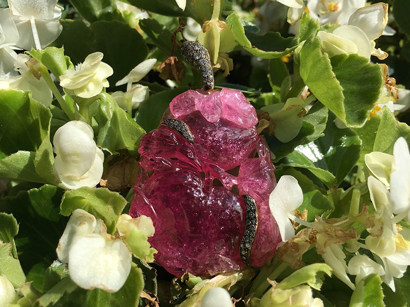 Verney The engraved Tourmaline Pendant is carved within 193.03 carats of pink tourmaline set with grey diamonds and purple sapphires mounted on gold.