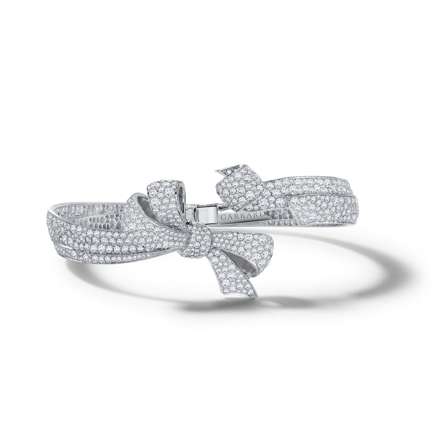 Garrard Bow bangle mounted on white gold with diamonds