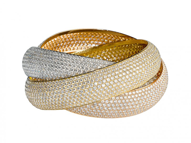 Trinity ring by Cartier on rose, yellow and rose gold set with diamonds
