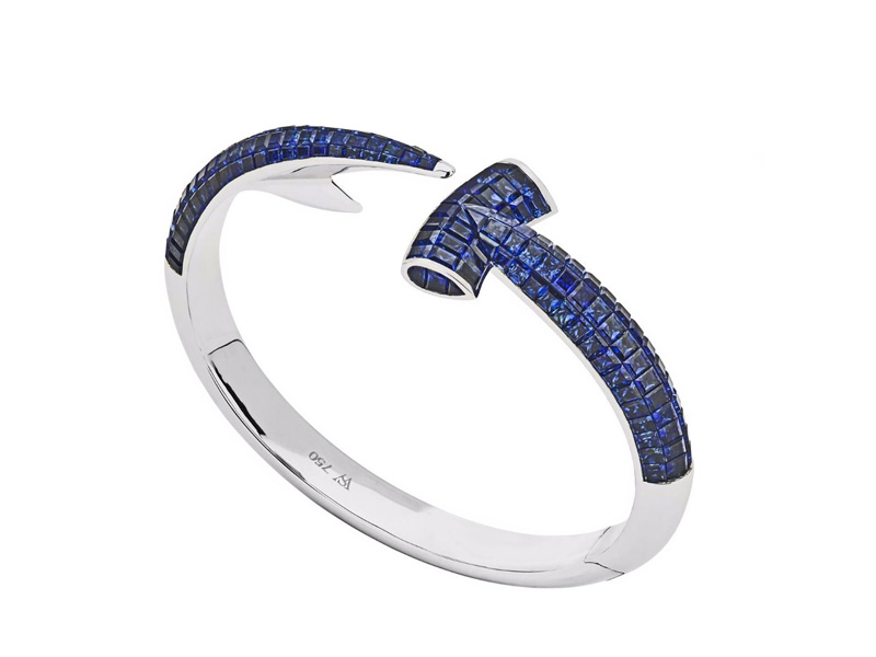 Stephen Webster Hammerhead hand crafted in 18 karat white gold and completed with square cut blue sapphires 