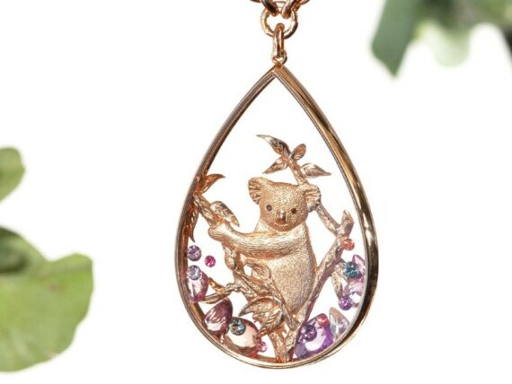 Alexandra Abramczyk Koala pendant mounted on rose gold with sapphires peach rose cut and multicolored round sapphires